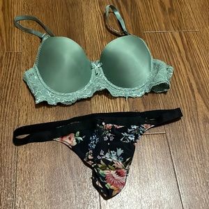 Two piece green lace bra and black floral thong